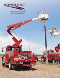 High West Energy 2014 Annual Report cover shows utility workers in bucket trucks working on power lines.