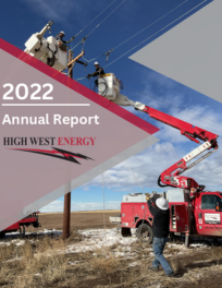 2022 Annual Report High West Energy, featuring utility workers in bucket trucks repairing power lines.