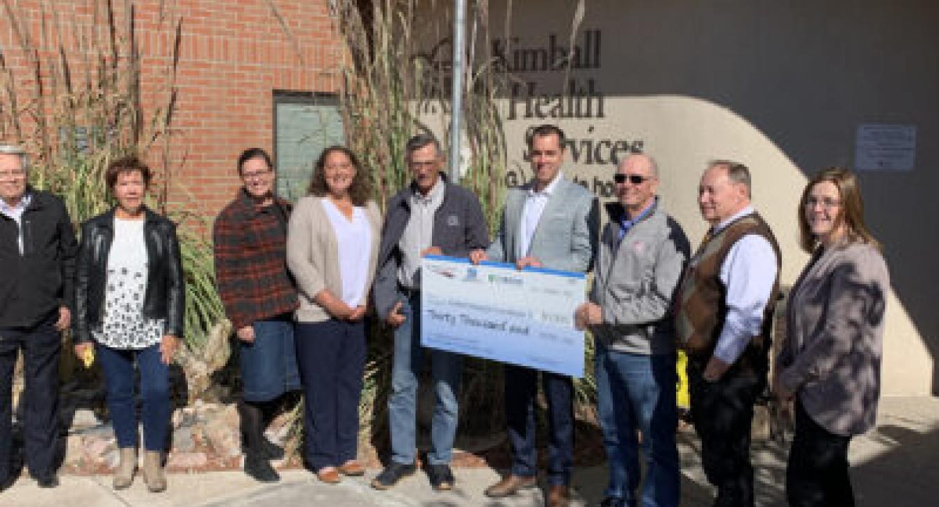High West Energy presents a donation of $30,000 to the Kimball Hospital Foundation. Pictured, are, FROM LEFT, Kimball Hospital board members Jerry Knutsen and Karen Morrison, High West board member Kosha Olsen, High West CFO Lindsay Forepaugh, High West board member Kevin Thomas, High West CEO Jared Routh, Kimball board member Jim Cederburg, Kimball Health Services CEO Ken Hunter, and Kimball board member Cassie Gasseling.
